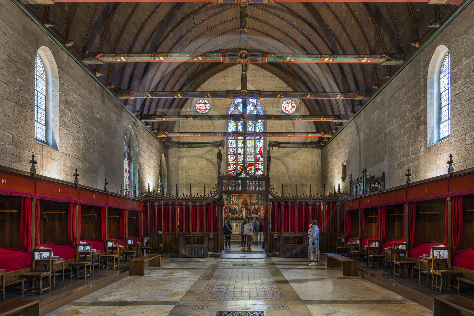 France, Cote d'Or, Beaune, area listed as World Heritage by UNESCO, Hospices de Beaune, Hotel Dieu, the Great Hall of the Poor, frame in oak paneling and engouled beams, the chapel separated by a rood screen is at the end of the room