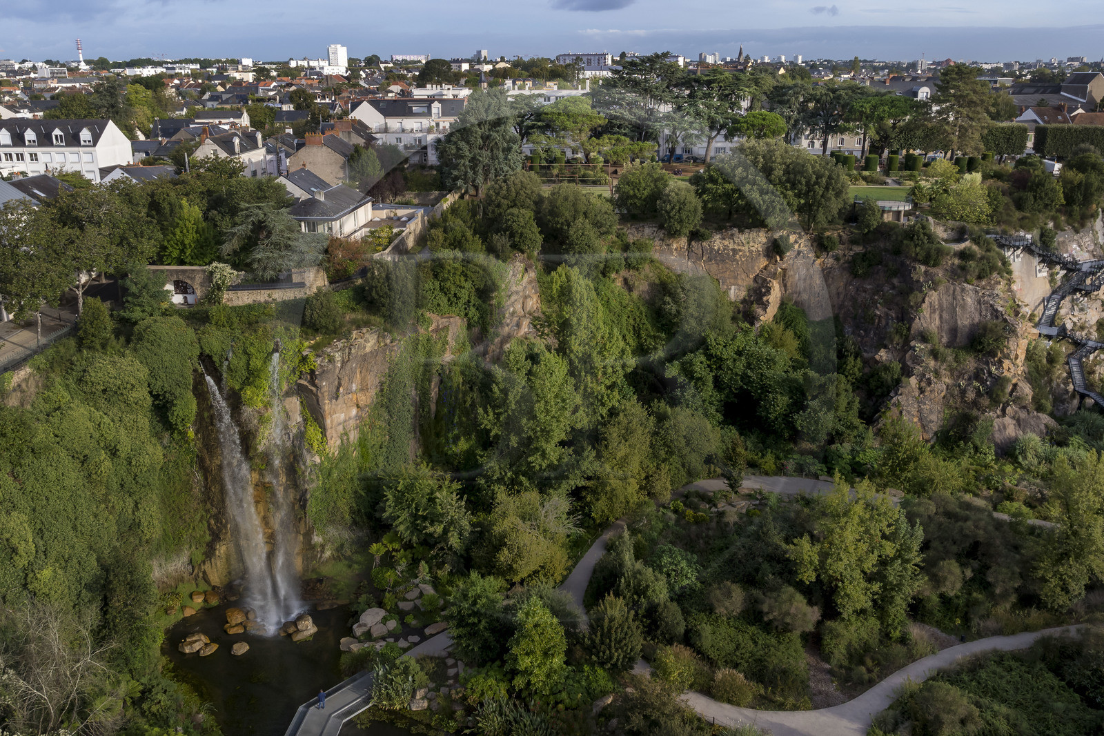 France, Loire Atlantique, Nantes, Chantenay district, the Extraordinary Garden, public park located in the former Misery Quarry with its 25 m high artificial waterfall (aerial view)