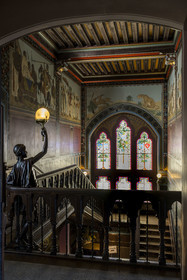 France, Pyrenees Atlantiques, Basque Country coast, Hendaye, Abbadia castle built in 1870 by Eugène Viollet-le-Duc for Antoine d'Abbadie d'Arrast, the grand staircase, torchiere lamp statue representing Abdullah former Ethiopian slave freed and dead under the commune of Paris