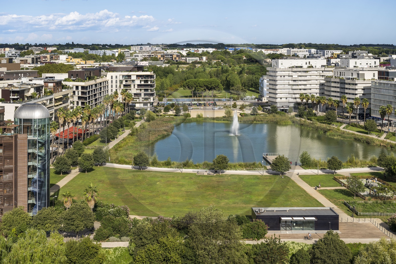 France, Herault, Montpellier, Port Marianne district, apartment buildings around the Bassin Jacques Coeur and the Georges Charpak Park in the background