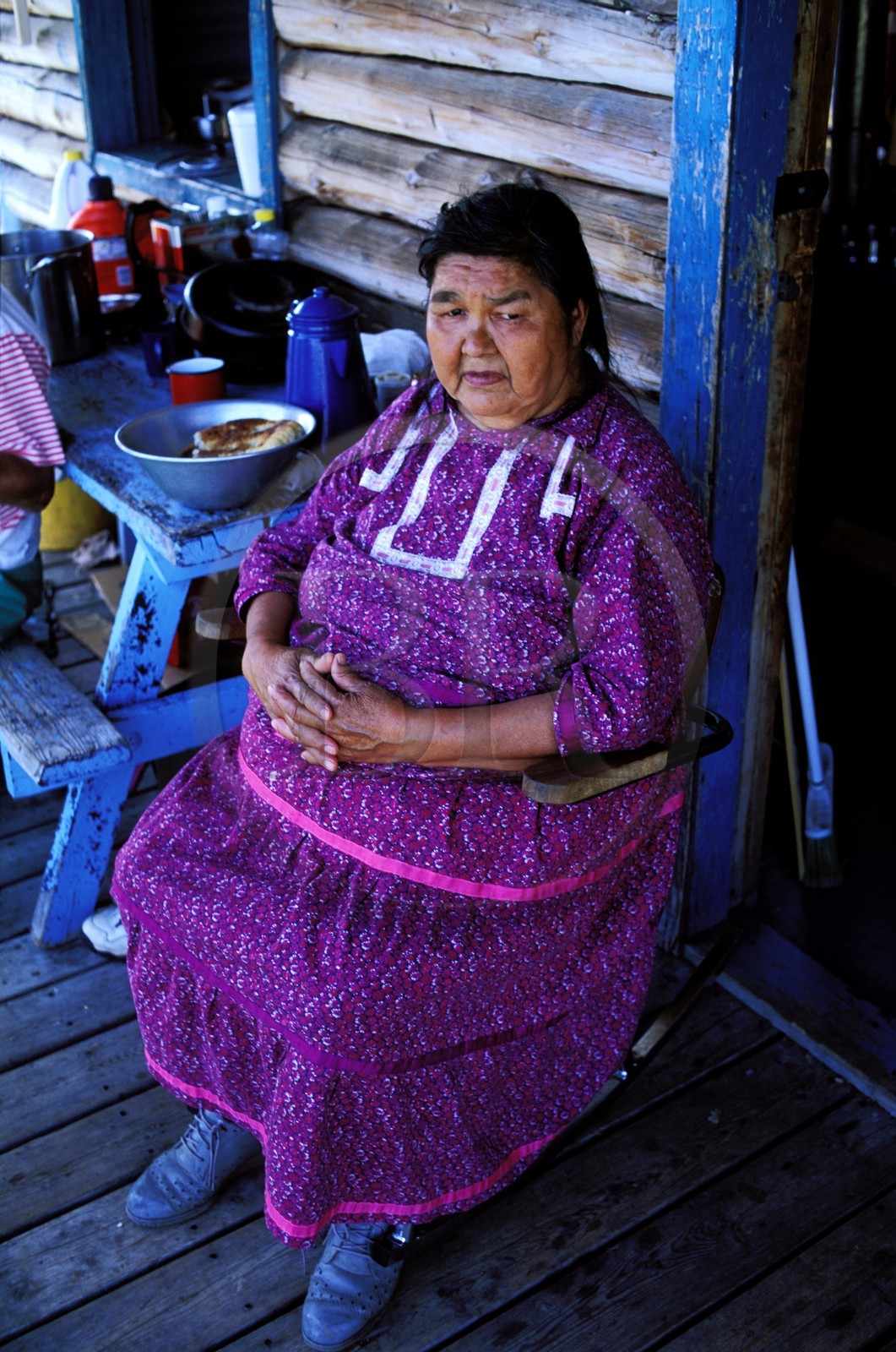 Canada, Quebec Province, La Verendrye Wildlife Reserve, Lake Victoria, village of Big Lake Victoria, Algonquian woman on her porch