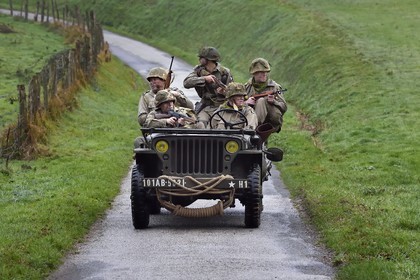 France, Eure, Sainte Colombe prés Vernon, Allied Reconstitution Group (US World War 2 and french Maquis historical reconstruction Association), reenactors in uniform of the 101st US Airborne Division progressing in a jeep Willys