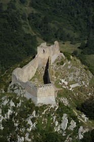 France, Ariege, Pays d' Olmes, Cathar Castle of Montsegur perched on a rock and the Pyrenees (aerial view)..