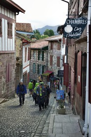 France, Pyrenees Atlantiques, Basque Country, Saint Jean Pied de Port, rue de la Citadelle on the Way of St. James, pilgrims
