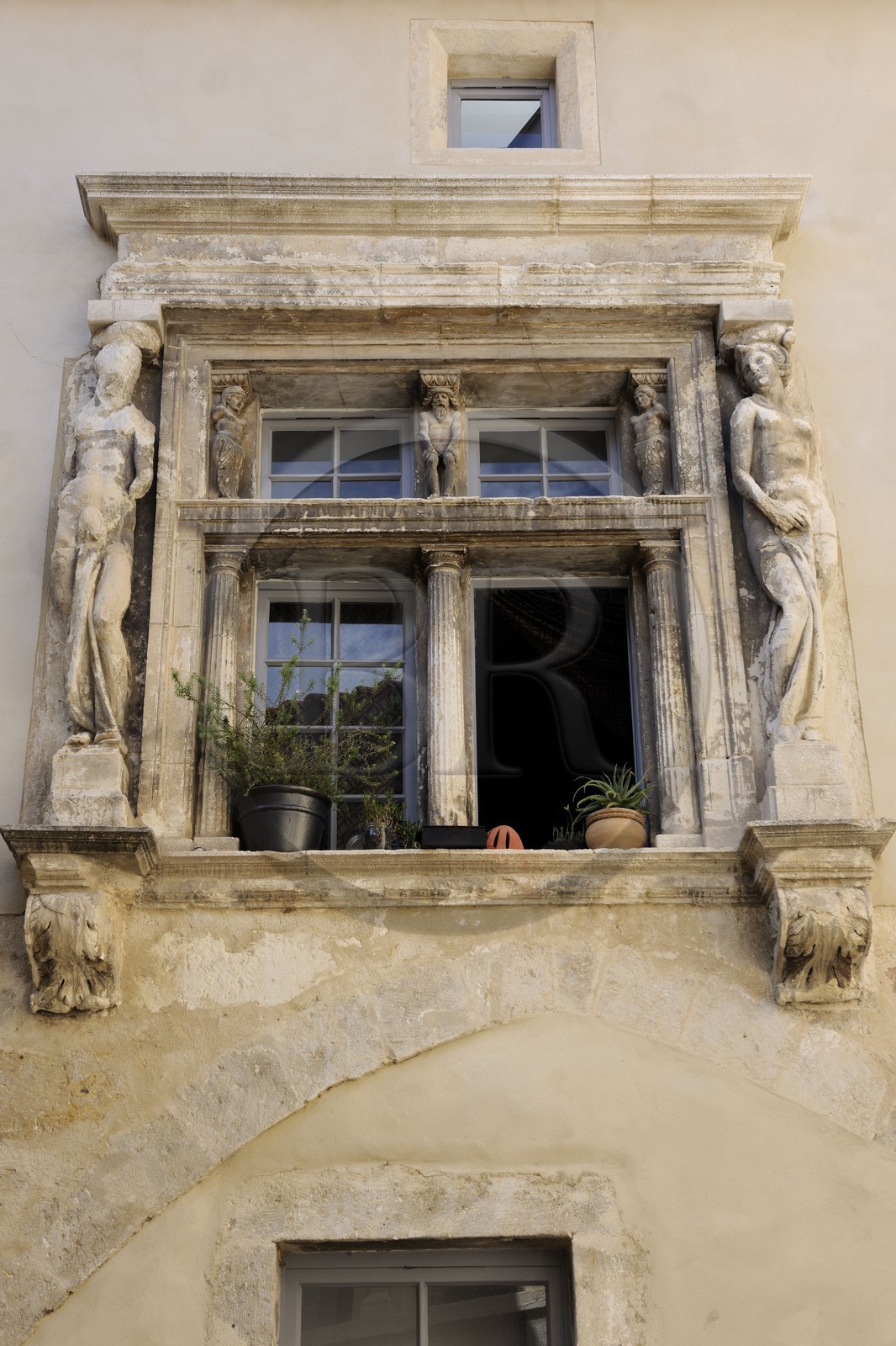 France, Herault, Beziers, former Renaissance mansion transformed into social housing in Gaveau street, window framed by caryatids