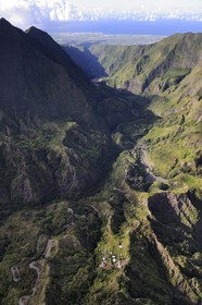 France, Reunion island (French overseas department), cirque of Cilaos, listed as World Heritage by UNESCO, National Highway 5 access road to the cirque also known as the 400 turns road and the West coast towards St. Louis in the background (aerial view)