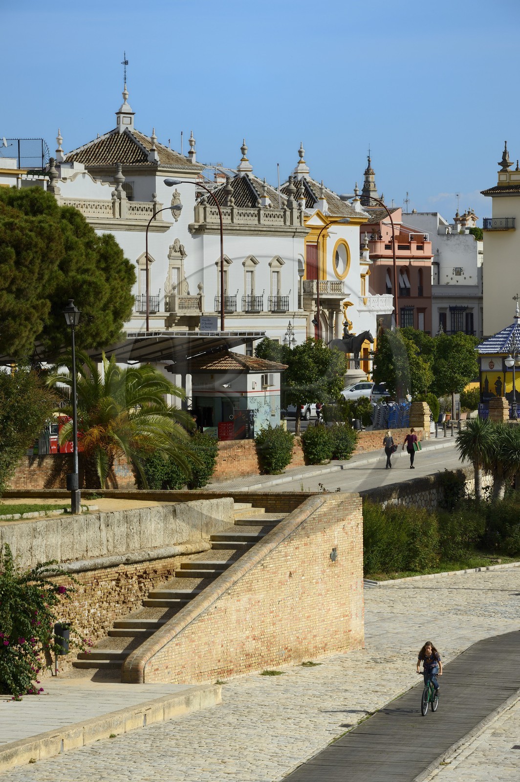 Spain, Andalusia, Seville, Guadalquivir river Banks, the Paseo de Cristobal Colon (Christopher Columbus) and the Maestranza bullring (plaza de Toros) in the background