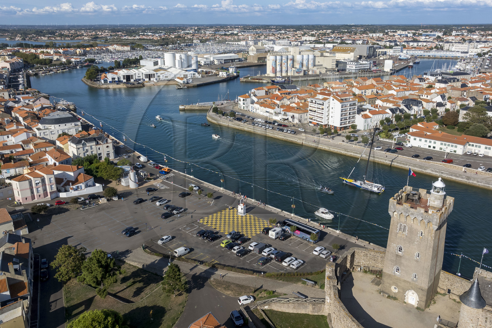France, Vendee, Les Sables d'Olonne, boats in the access channel to the ports and the 14th century Arundel Tower, a former keep converted into a lighthouse and maritime museum (aerial view)