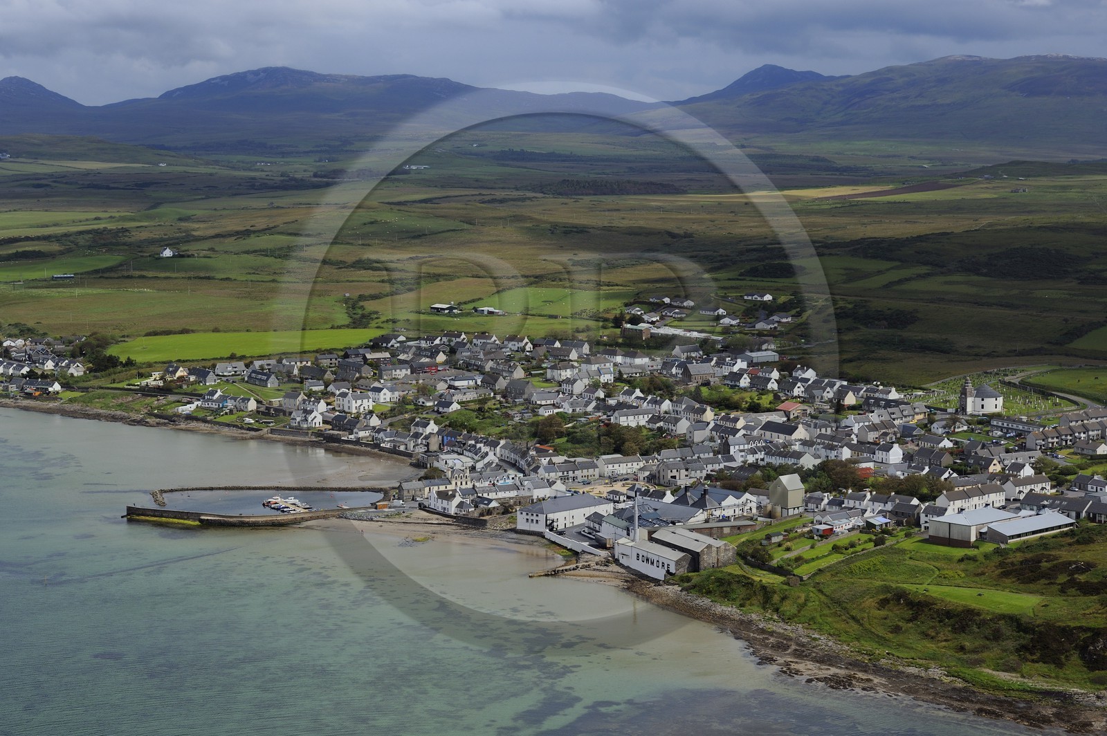 United Kingdom, Scotland, Inner Hebrides, Islay Island, Bowmore and the Bowmore Scotch whisky distillery on the eastern shore of Loch Indaal (aerial view)