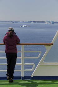 Greenland, Southern Region, Princess Danae cruise ship passing icebergs off Nanortalik