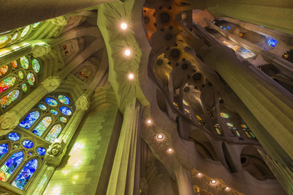 Spain, Catalonia, Barcelona, Eixample district, Sagrada Familia basilica by Catalan modernist architect Antoni Gaudi, listed as a UNESCO World Heritage Site, stained glass windows of the apse above the ambulatory by the Catalan painter and glassmaker Joan Vila-Grau