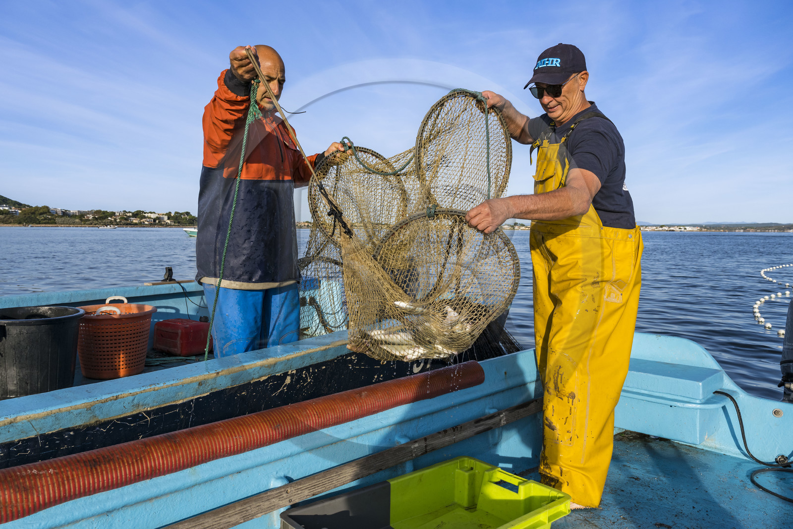 France, Herault, Sete, la Pointe Courte district, the fisherman Robert Rumeau lifts his nets on the Etang de Thau
