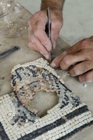 France, Rhone, Lyon, Saint Romain en Gal, Gallo-Roman Museum of Saint-Romain-en-Gal mosaics restoration workshop, restoration of a 2nd century mask of the house five mosaics