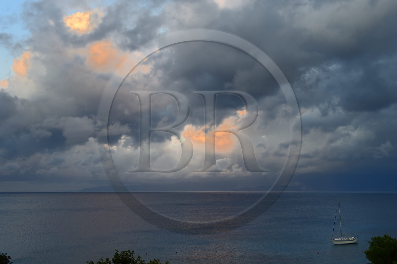 Greece, Crete, Agios Nikolaos region, Elounda, stormy sky at sunset