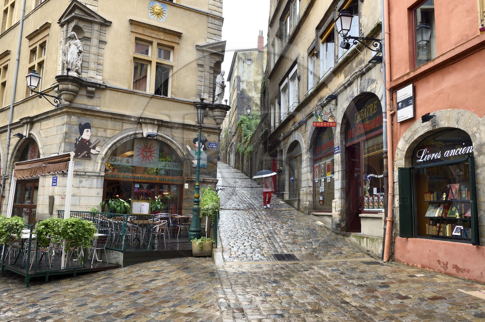 France, Rhone, Lyon, historical site listed as World Heritage by UNESCO, Vieux Lyon (Old Town), Saint George district, the place de la Trinite with the Café du Soleil served as the backdrop for the puppeteers putting on Guignol shows, and the montee du Gourguillon on the right