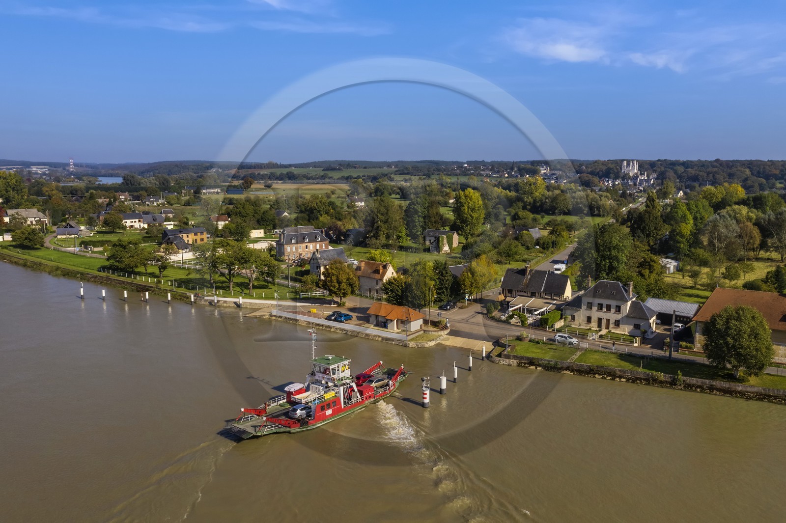 France, Seine-Maritime, Pays de Caux, Norman Seine River Meanders Regional Nature Park, the ferry crossing the Seine at Jumieges which abbey is in the background