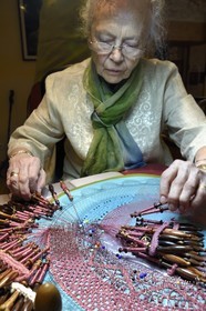 France, Haute Loire, Brioude, Couleurs Dentelle Art workshop, lace maker Irina Fougeron on a traditional tile, bobbin lace