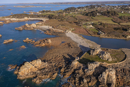 France, Cotes-d'Armor, Cote d'Ajoncs, Plougrescant, site of the Plougrescant Gouffre, the small house of Castel Meur, any representation for commercial use of this house is prohibited, and the place called La Pointe du Chateau in the background (aerial view)