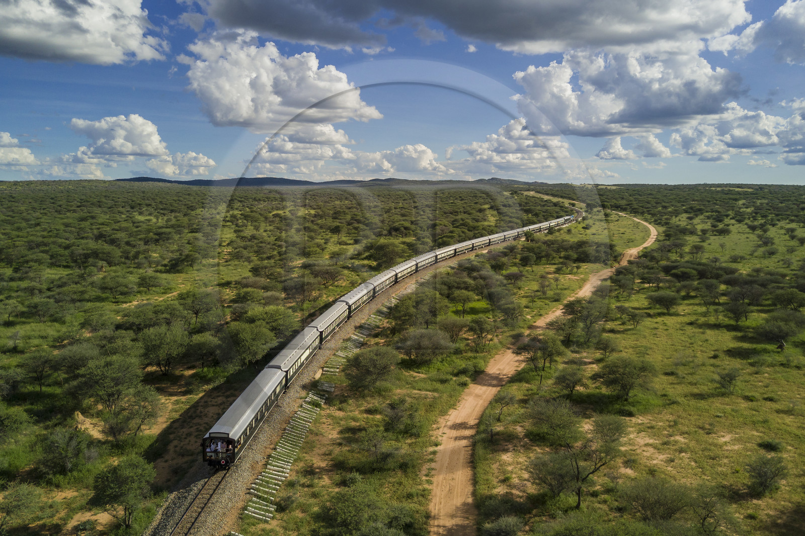 Namibia, Otjozondjupa region, the Shongololo express train crossing the Namibian bush towards Kalkfeld (aerial view)