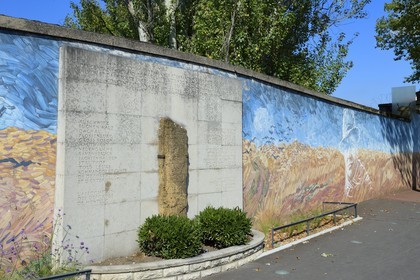 France, Rhone, Lyon, Montluc Prison Memorial, Jean Moulin hero of the Resistance painted on the outside wall of the enclosure