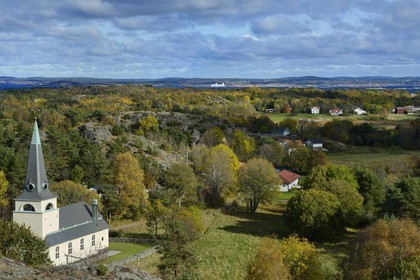 Sweden, Västra Götaland, Koster Islands, Sydkoster, the island church seen from the Valfjäll rock, Stromstad ferry and the mainland coast in the background
