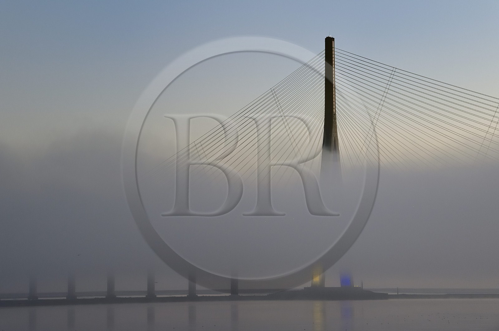 France, between  Calvados and Seine Maritime, the Pont de Normandie (Normandy Bridge) in the mists of dawn, it spans the Seine to connect the towns of Honfleur and Le Havre