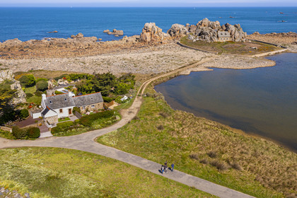 France, Cotes-d'Armor, Cote d'Ajoncs, Plougrescant, site of the Plougrescant Gouffre, the small house of Castel Meur in the background, any representation for commercial use of this house is prohibited (aerial view)