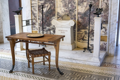 France, Alpes-Maritimes, Beaulieu-sur-Mer, neo-Greek style villa Kerylos build in 1908 by architect Emmanuel Pontremoli, the Andron or men's lounge, traditional three-legged table and household offering altar