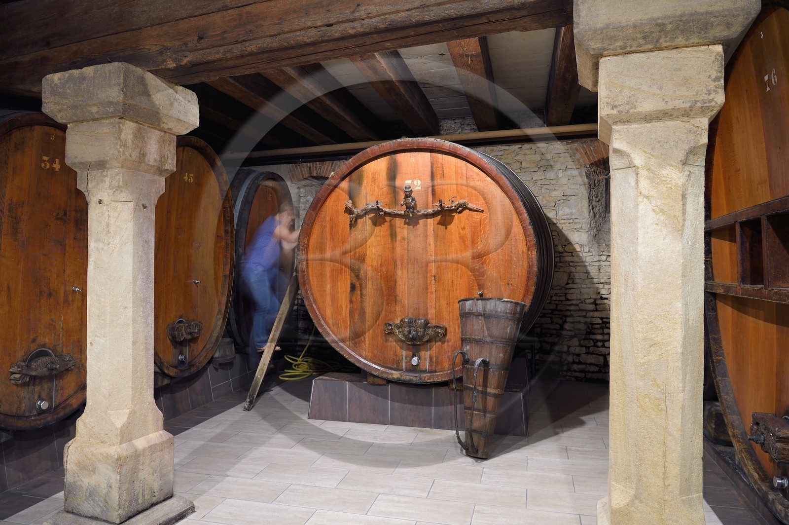 France, Bas Rhin, the Alsace Wine Route, Mittelbergheim, labelized the Most Beautiful Villages of France, 16th century underground cellars of the Wine estate GILG, centenary large barrel