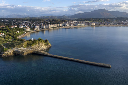France, Pyrenees Atlantiques, Basque Country coast, Saint-Jean-de-Luz, the Sainte-Barbe sea wall at the entrance to the bay of Saint-Jean-de-Luz, the Grande Plage and the La Rhune mountain in the background (aerial view)