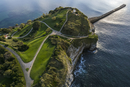 France, Pyrenees Atlantiques, Basque Country coast, Saint-Jean-de-Luz, the coastal path on the GR 8 passing over the flysch cliff of Pointe Sainte-Barbe, a sort of mille-feuille alternating hard and soft rocks, closing the bay of Saint-Jean-de-Luz (aerial view)