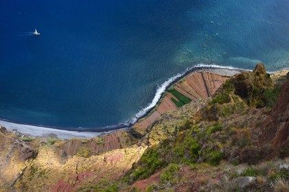 Portugal, Madeira Island, view from the Cap Girao belvedere, glass platform overlooking the second highest cliff in the world at 589 meters high, cultivated fields at the foot of the cliff