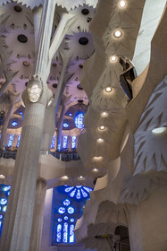 Spain, Catalonia, Barcelona, Eixample district, Sagrada Familia basilica by Catalan modernist architect Antoni Gaudi, listed as a UNESCO World Heritage Site, the east side of the Nave and bronze statue of Saint George by the sculptor Subirachs in the center of the interior of the facade of Glory