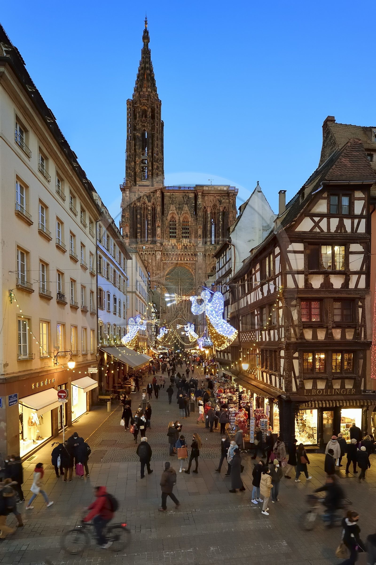 France, Bas Rhin, Strasbourg, old town listed as World Heritage by UNESCO, the western facade of Notre Dame Cathedral and rue Merciere with its Christmas decorations