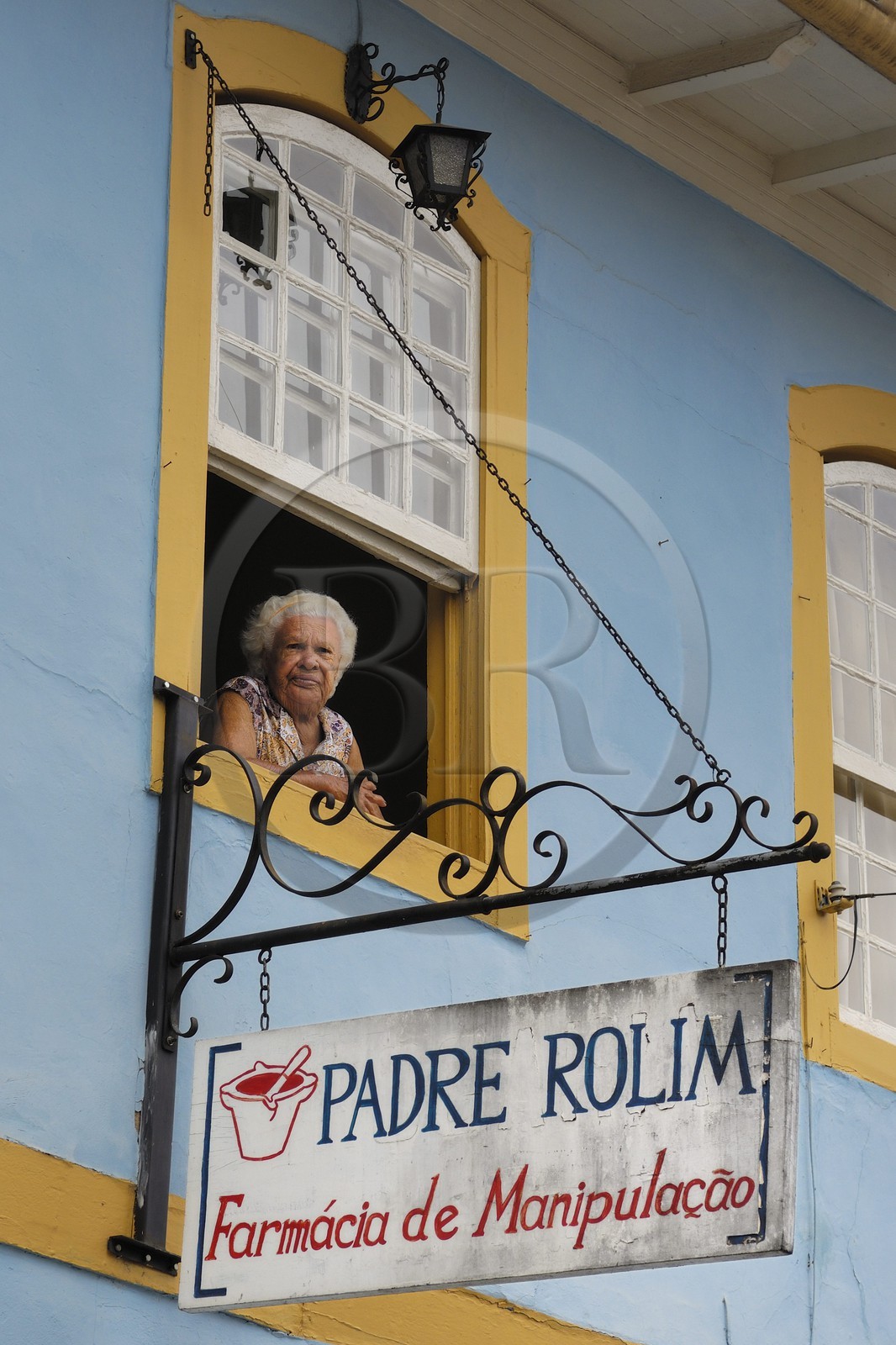 Brazil, Minas Gerais state, town of Mariana, woman at the window of a traditional dwelling (Gold Route, Estrada Real)