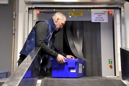 Norway, Svalbard, Spitzbergen, Longyearbyen, Svalbard Global Seed Vault (Seed Bank), arrival and scanning of seeds at the airport baggage claim area performed by NordGen