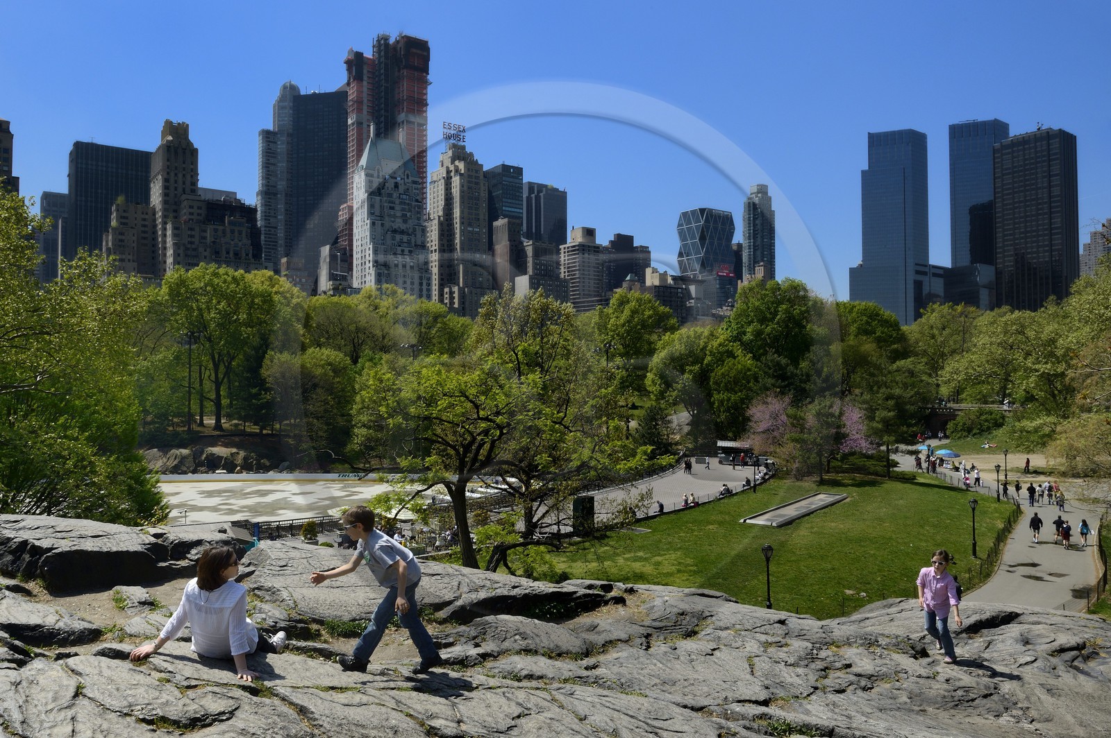 United States, New York City, Manhattan, Central Park, the rocks near the Pond, buildings of Midtown and the Time Warner Center (on the right) in the background