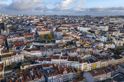 Portugal, Lisbon, Bica district, on the left the promontory of Miradouro de Santa Catarina and on the right the Bica district which surrounds the street of its funicular (aerial view)