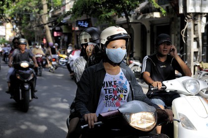 Vietnam, Hanoi, motorcycle traffic in the old city, protection against the polllution