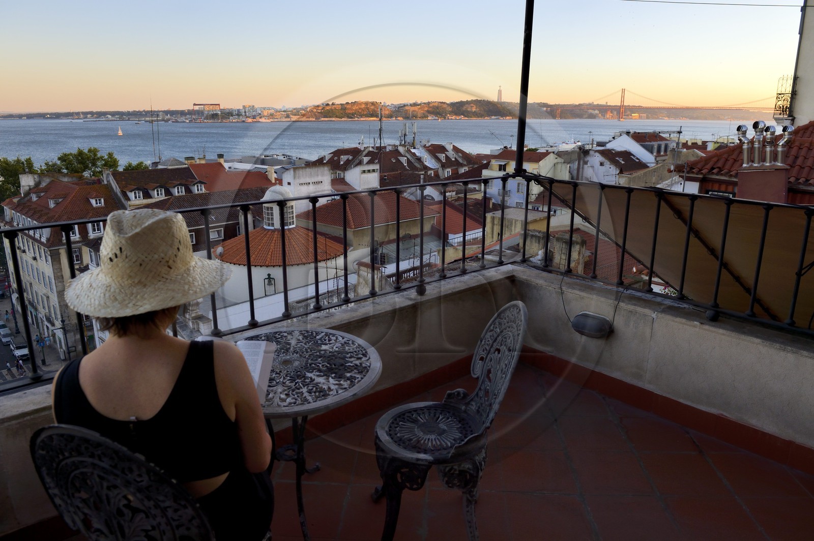 Portugal, Lisbon, Chiado district, terrace with view on the south bank of the Tagus river and the 25 de Abril bridge