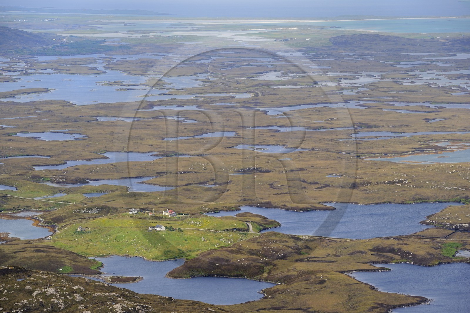 United Kingdom, Scotland, Outer Hebrides, Isle of North Uist covered with a patchwork of peat bogs, low hills and lochans (aerial view)