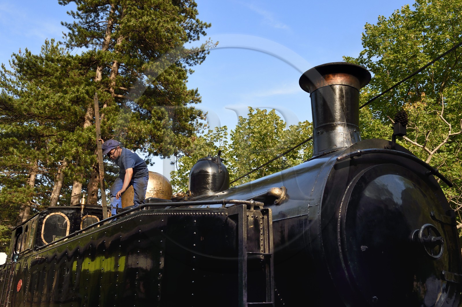 France, Alpes-Maritimes, Puget Theniers, steam engine warming up, Benoit Prudhomme-Lacroix Lacroix is one of the youngest volunteers of the G.E.C.P. that restores and operates the Train des Pignes, checking the water level