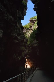 France, Alpes Maritimes, Mercantour Massif, Gorges of Cians carved by the Cians river in red lutite soil, portion of the old road now abandoned at the place called The Great Clue