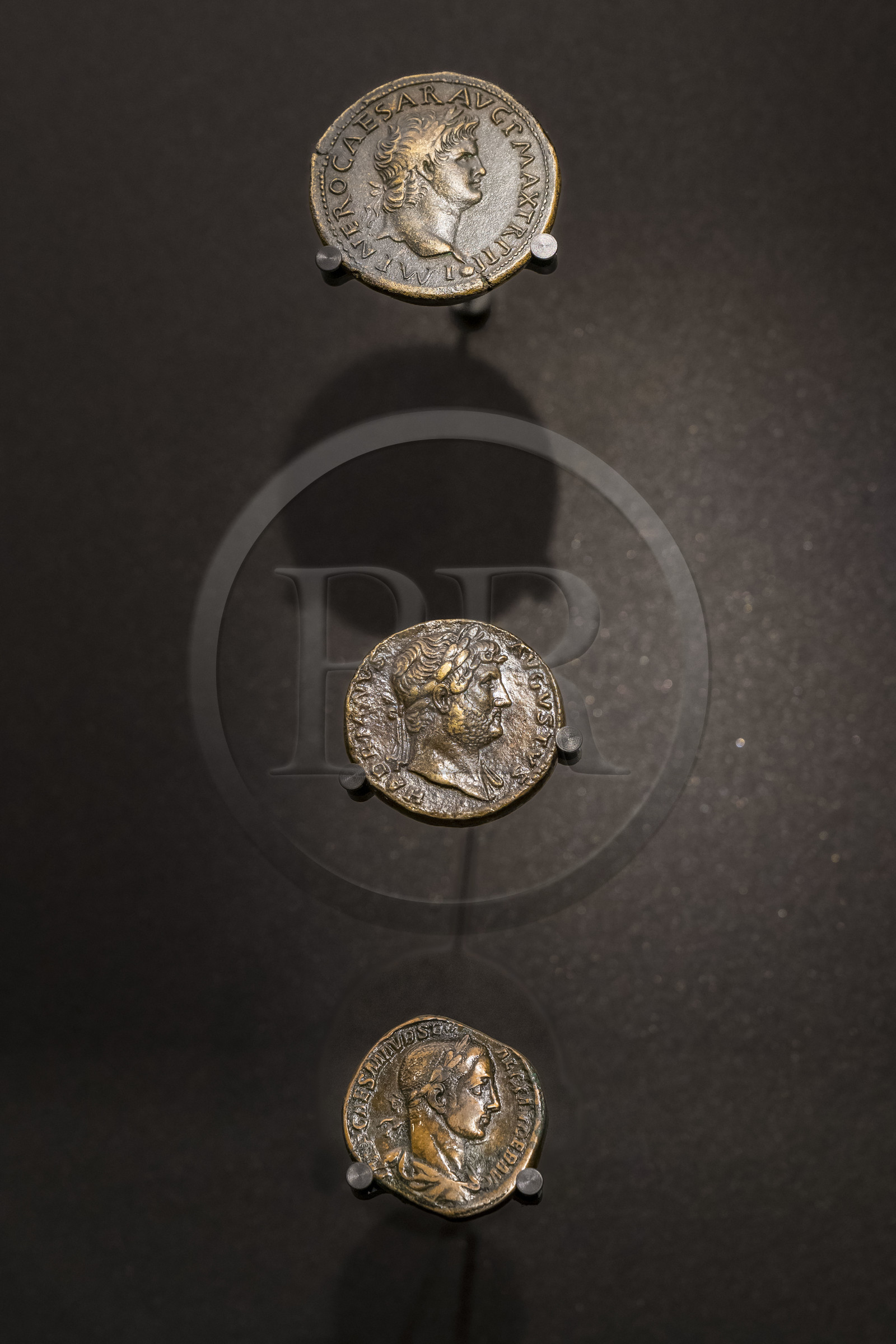 France, Paris, the Monnaie de Paris (Paris Mint) Museum, Sestertius of Nero (54-68 AD), Sestertius of Hadrian (126 AD) and Sestertius of Severus Alexander (222-235 AD) coins
