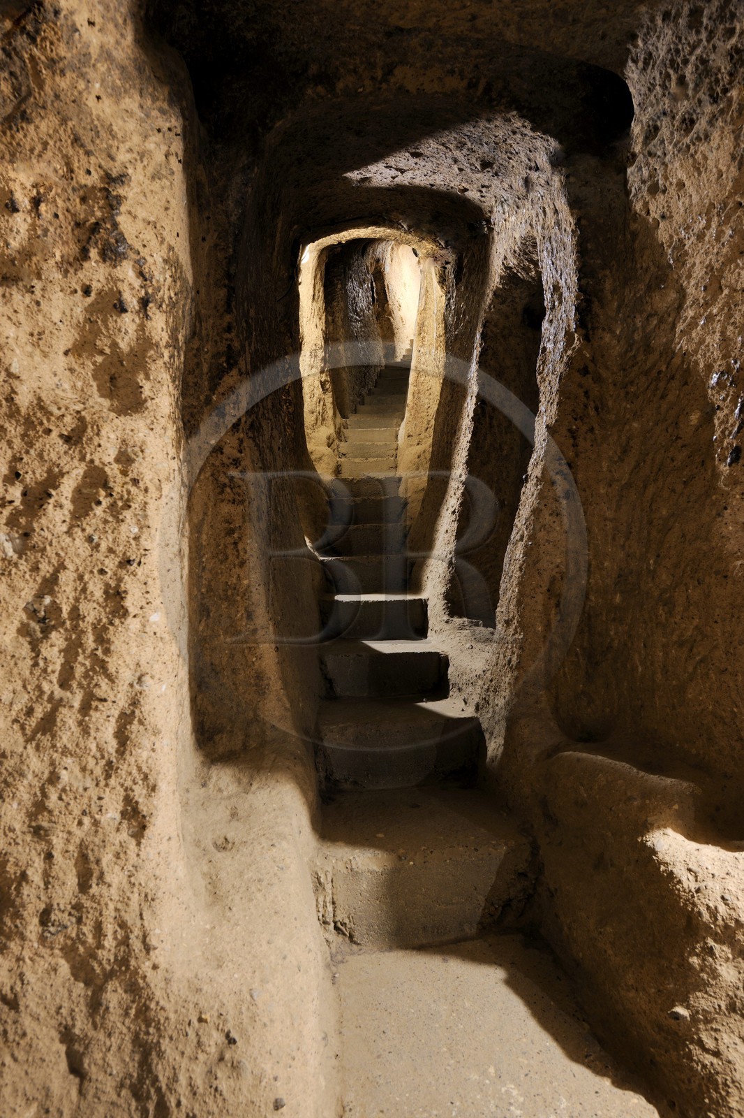 Turkey, Central Anatolia, Nevsehir Province, Cappadocia listed as World Heritage by UNESCO, Kaymakli underground town on eight levels, staircase connecting the levels