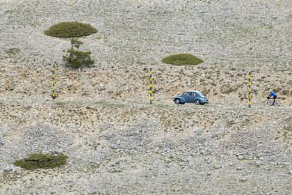 France, Vaucluse, Parc Naturel Regional du Mont Ventoux, Bedoin, bike ascent of Mont Ventoux by the D974 road on the southern slope towards the summit and Renault 4CV from the 1960s