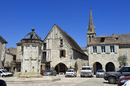 France, Dordogne, Perigord Pourpre, Bastide of Eymet, central square (Place Gambetta) and its arcades, the church of Our Lady of the Assumption in the background
