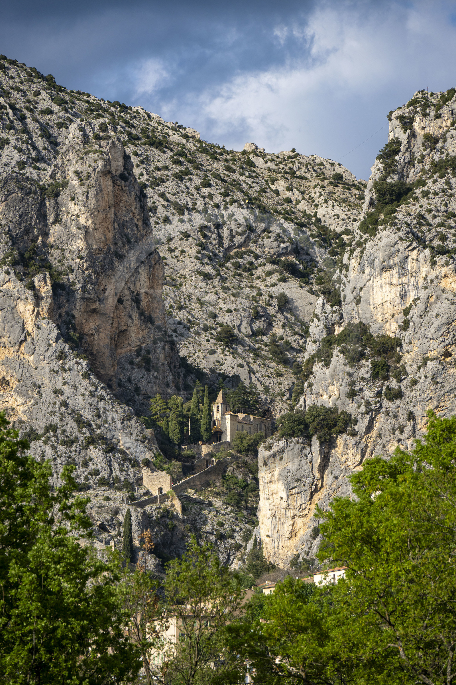 France, Alpes de Haute Provence, Parc Naturel Régional du Verdon, village of Moustiers Sainte Marie, labelled Les Plus Beaux Villages de France (The Most Beautiful Villages of France), Notre Dame de Beauvoir chapel in the cliffs