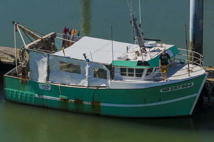 France, Charente Maritime, Oleron island, port of La Cotinière, flood basin built in 2022 at the foot of the new fish market, fisherman Yoann Crochet on his trawler L'Univers intended for artisanal coastal fishing (aerial view)