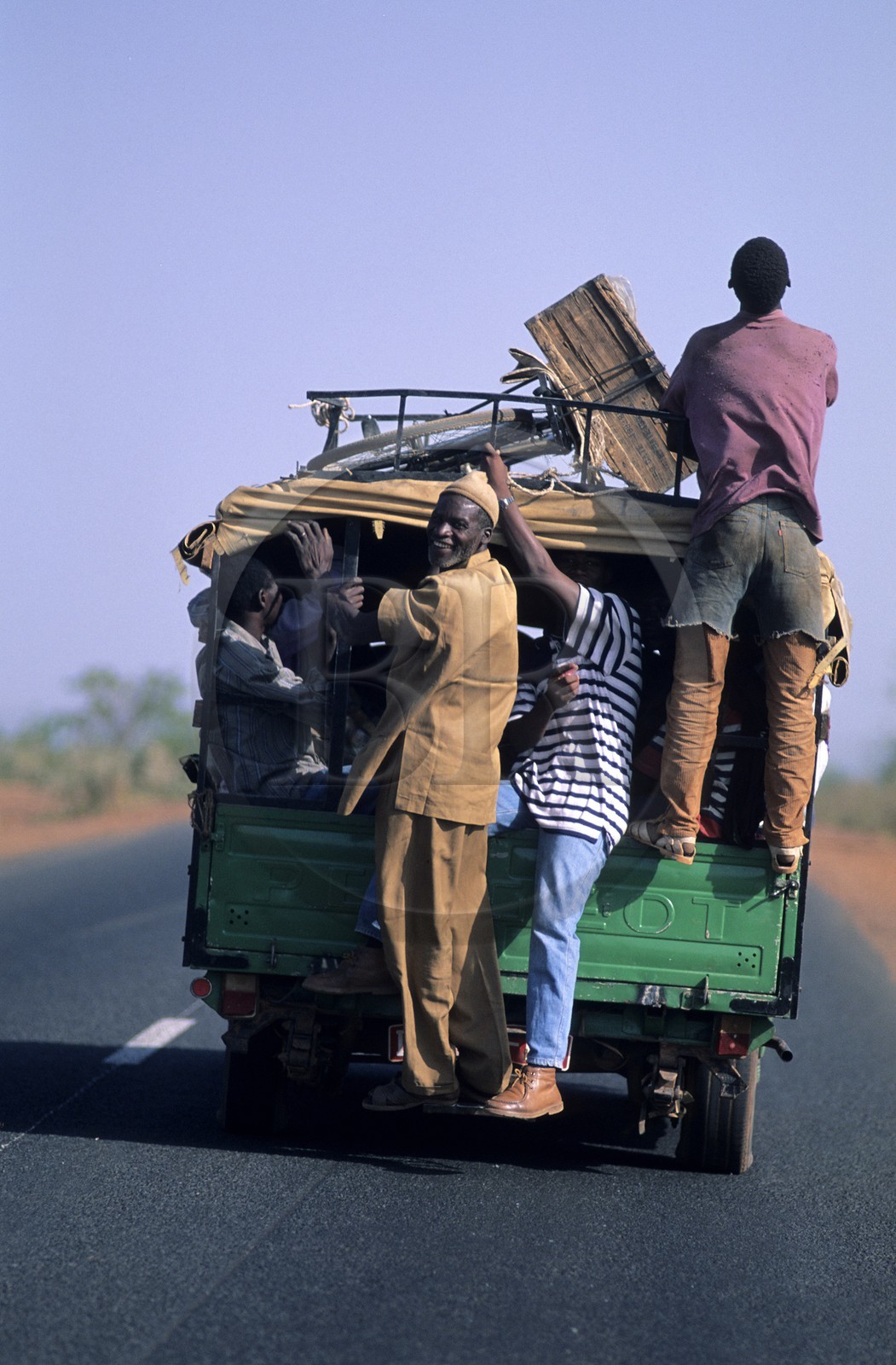 Mali, overloaded van on the road